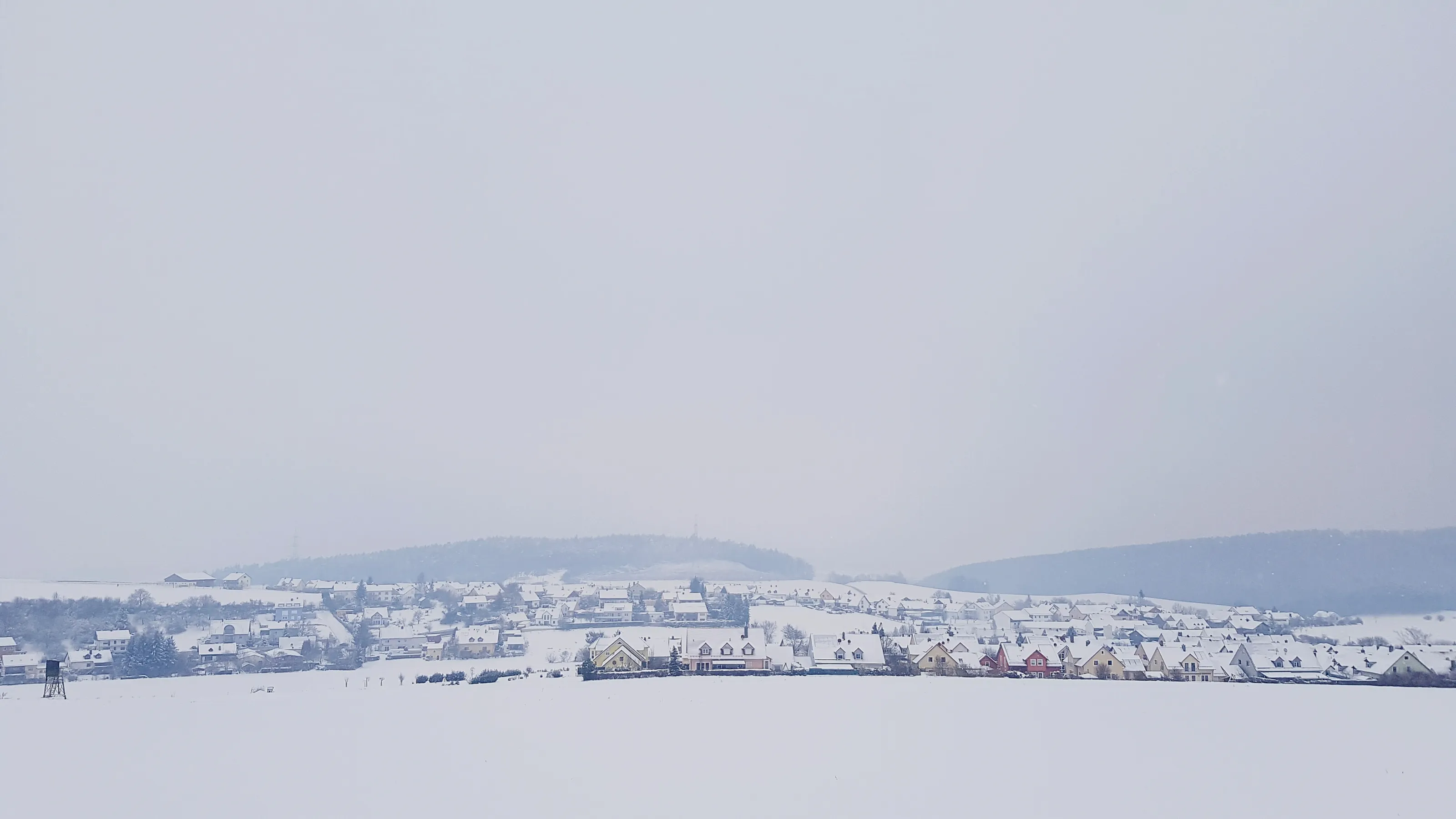 scenic-view-village-against-sky-winter.jpg